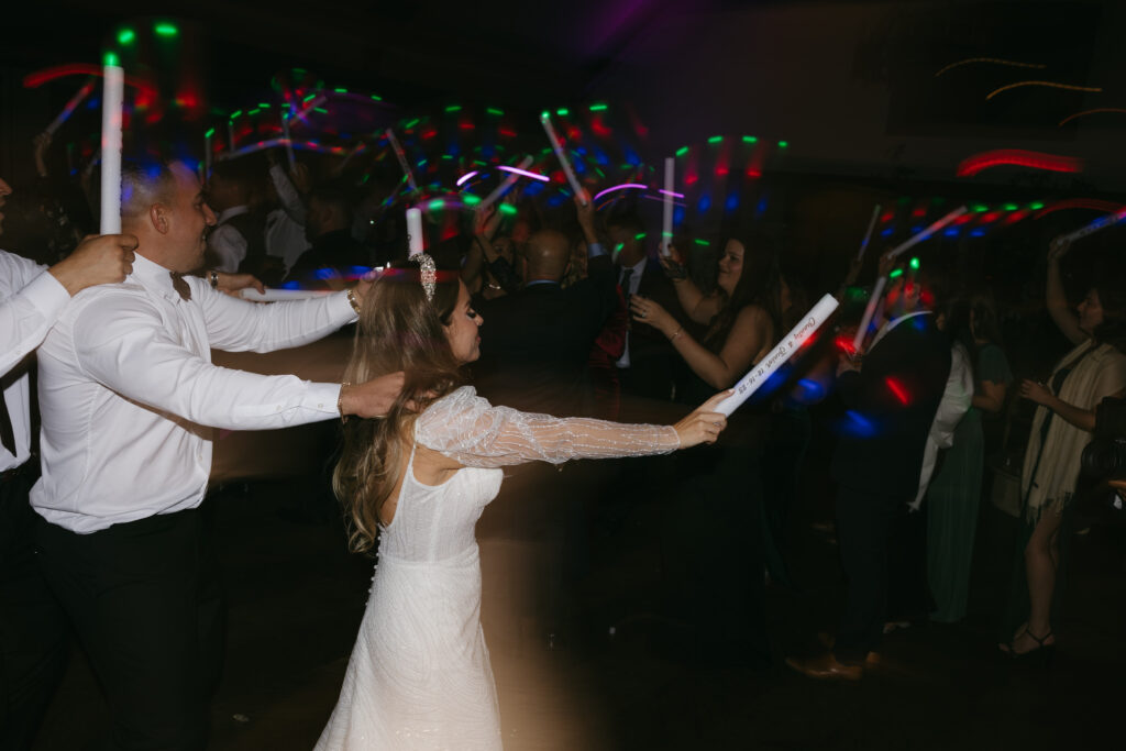 Wedding reception, dancing with glow sticks | Megan Kuhn Photography