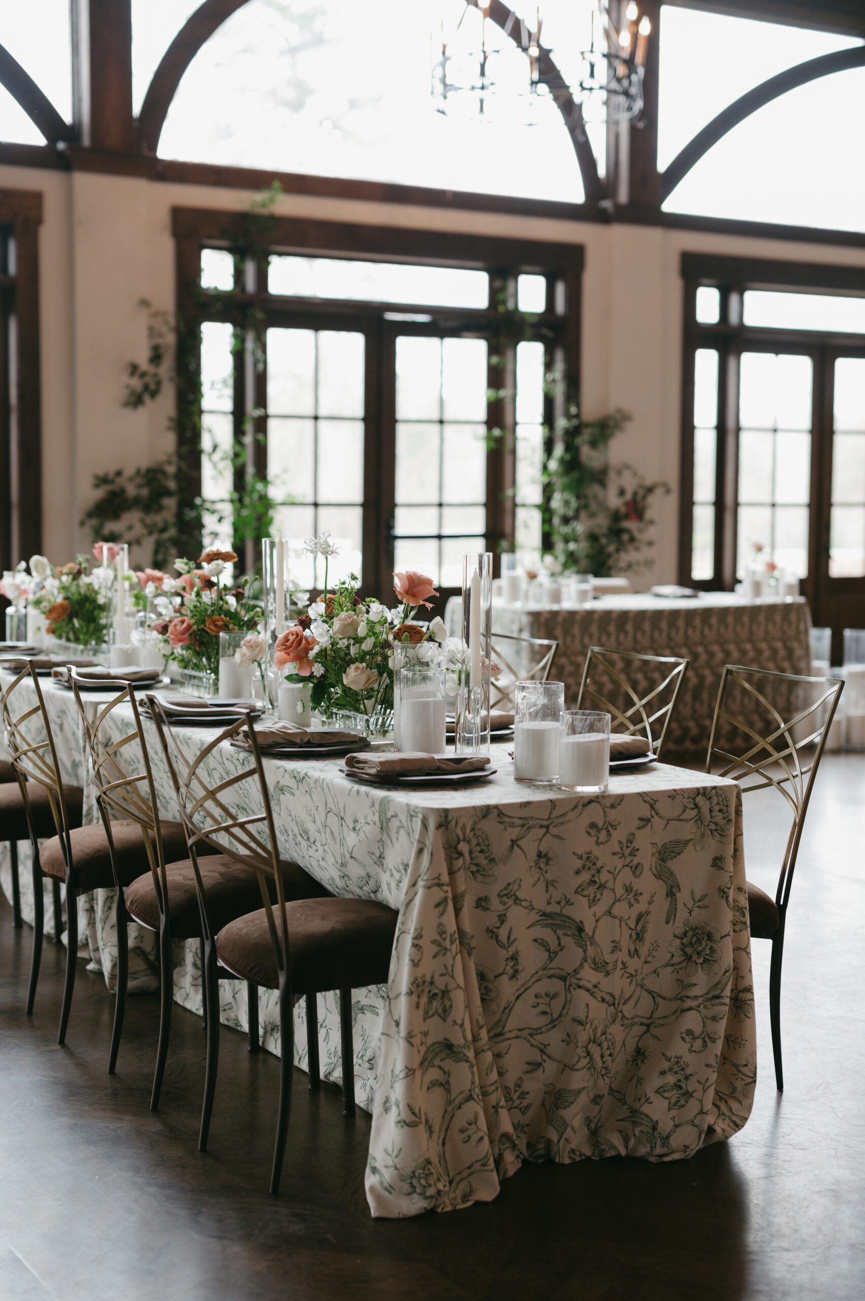 This modern garden party wedding had a beautiful indoor reception with green and patterned linens with candles and flowers for an ethereal feel. | Megan Kuhn Photography