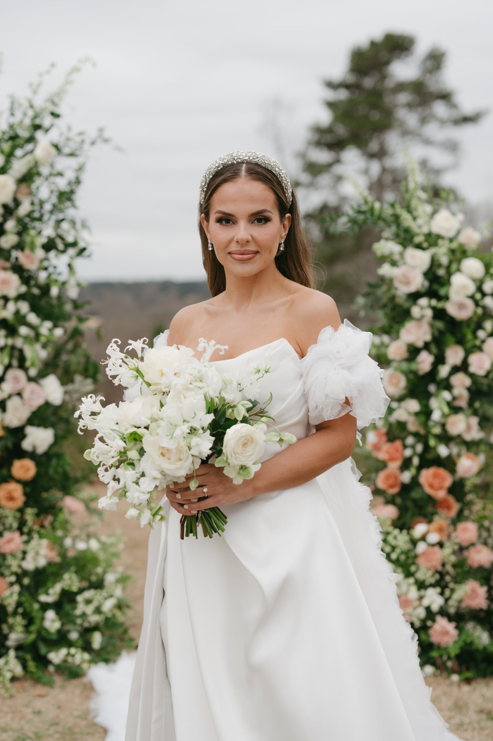 Chantelle, this gorgeous bride, wore a modern wedding dress and a secondhand bridal cape at her colorful luxury wedding at Foxhall Resort with a broken floral arch. | Megan Kuhn Photography