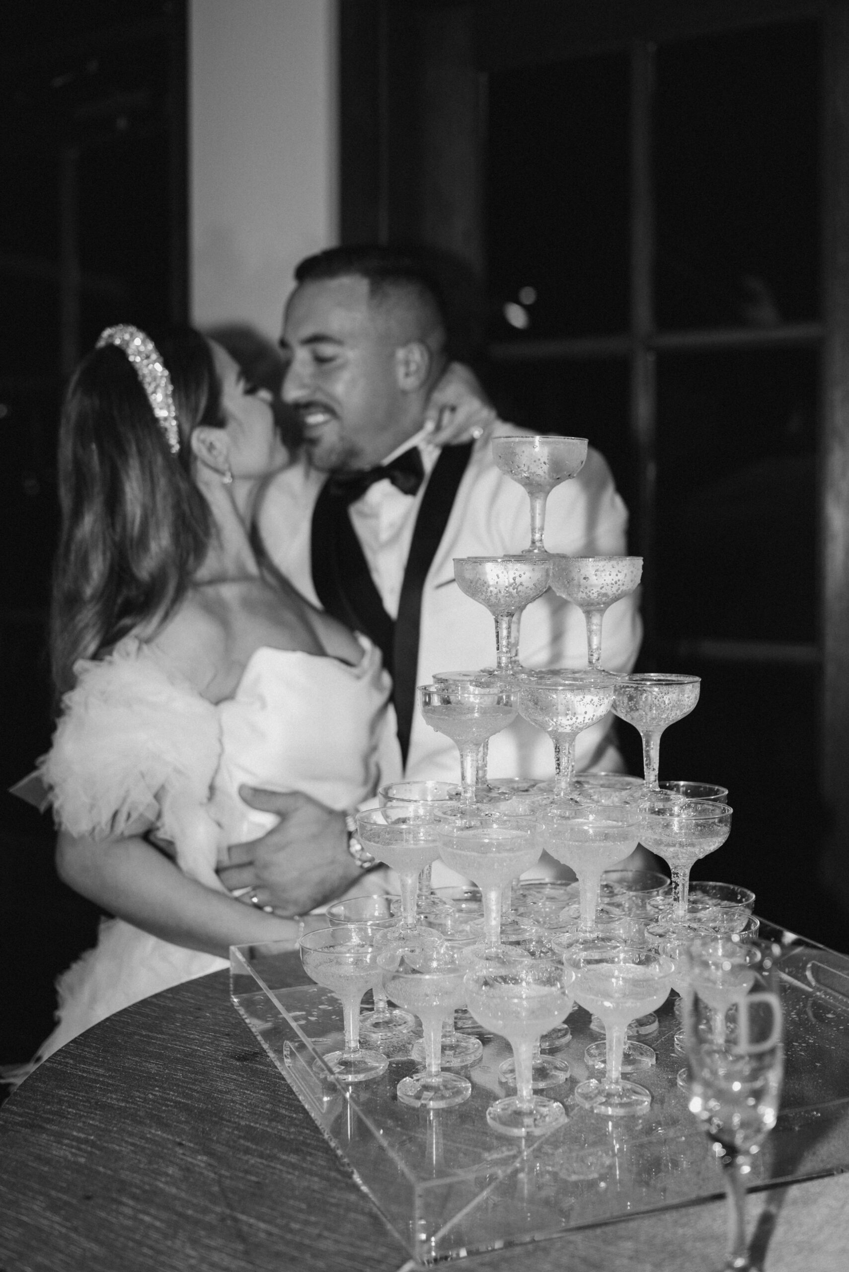 Wedding couple with champagne tower | Megan Kuhn Photography