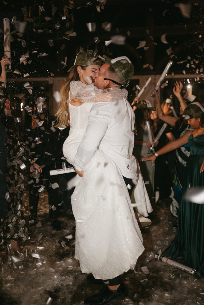 Confetti poppers on dance floor of wedding reception | Megan Kuhn Photography